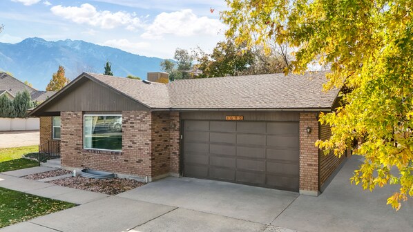 House front view, 2 car garage and outside parking