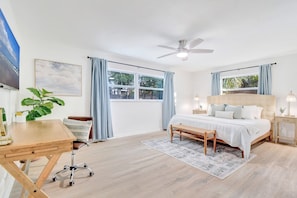 Large master suite with desk for getting ready or remote work.