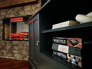 Play games or read books by the electric fireplace!