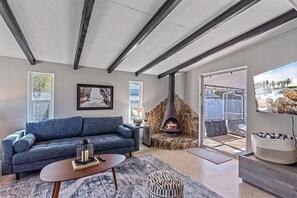 When you first enter the oasis, you are greeted with this beautiful living room with a large Smart TV (Indoor stove is not available for use at this time).