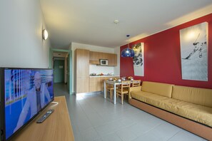 living room with kitchen and dining table view