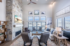 Featuring a large natural rock fireplace, 65" Samsung The Frame Smart TV and comfortable furnishings. It's the perfect place to gather and enjoy a mov