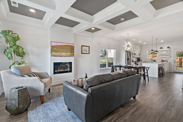 Ideal gathering space provided by a soft chenille sofa & accent chairs