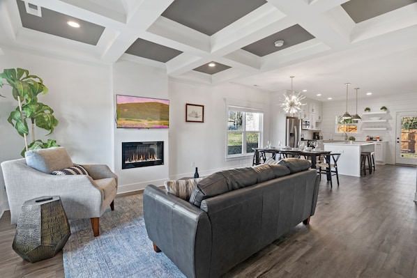 Ideal gathering space provided by a soft chenille sofa & accent chairs