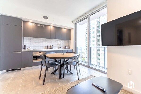 Luminous with natural light entering from the private balcony glass doors