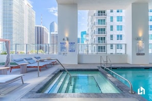 There's a shared jacuzzi at the swimming pool on the deck!
