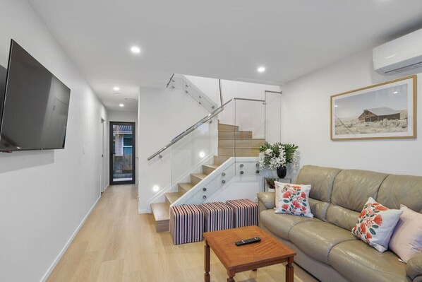 Relax on the couch and watch TV or stream your own Netflix.
