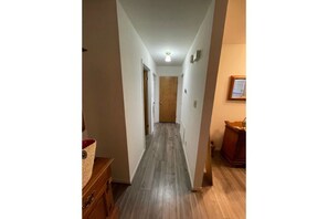 Hallway to bathroom / bedrooms