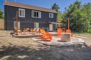 Gather 'round our communal fire pit nestled within a serene outdoor space.