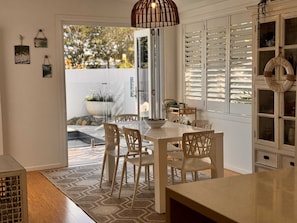 Dining area opens out overlooking pool