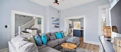 Inviting and cozy, this living room beckons with comfort, blending modern style and homely warmth for the perfect relaxation space