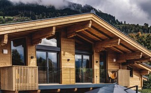 Chalet Amadeus is an old historic farmhouse, fully renovated and rebuilt to modern alpine architecture in 2022. The large glass walls and panels connect the exterior and interior.