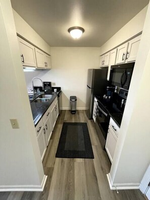 Fully-Stocked Kitchen with Granite Countertops