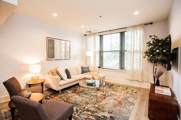 Living room, TV mounted to wall for easy viewing