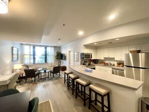 Long Kitchen Counter, seats 5, open walkway to sitting area
