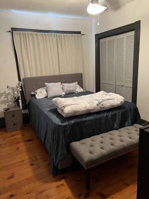 This is bedroom 1. This is a queen size bed that fit up to two people 