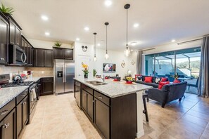 Relax and unwind in our uniquely spacious open-concept living room/kitchen area. Rest assured that our fully-equipped kitchen will accommodate your every need!