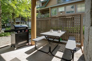 Covered outdoor patio off the main living area with BBQ/grill