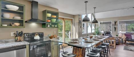 The spacious kitchen has room for making large meals, and the jumbo granite counter has more than enough room for 10 people to enjoy