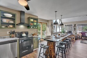 The spacious kitchen has room for making large meals, and the jumbo granite counter has more than enough room for 10 people to enjoy