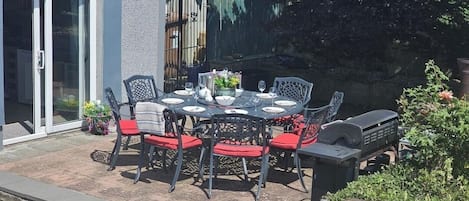 Patio area beside the kitchen with gas barbecue (gas provided). Chimenea also with logs provided.