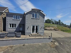 Front view of the property that has beautiful mountain and countryside views.