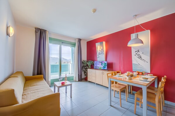 Living area with sofa bed and balcony view