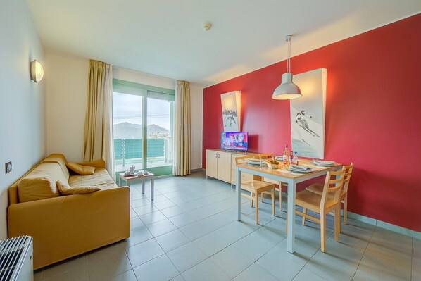 Living area with sofa bed and balcony view