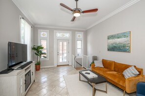 Cozy and spacious living area with TV