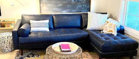 Leather sectional and flexible floor cushions. 