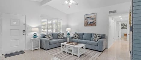 Large living room with a queen sofa bed. 