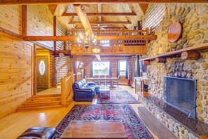 Experience the allure of our cabin's living room from unexpected angles, unveiling its beauty and functionality.