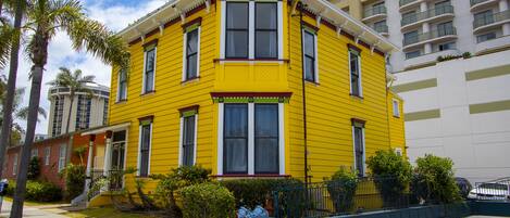 Charming sunny yellow house nestled in a vibrant neighborhood in San Diego.