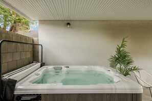 Relax and unwind in our outdoor jacuzzi, the perfect spot for a soothing soak