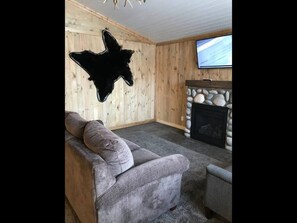 Gas fireplace and couches in living room