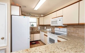 Ample space for prepping home-cooked meals on the newly installed quartz countertop.