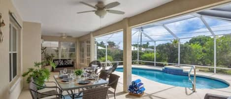 Private and relaxing screened covered pool and outdoor dining area