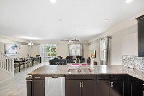 Spacious open-plan living area with modern comforts and easy access to outdoor relaxation.