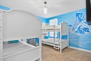 Delight in this enchanting ice-themed bedroom perfect for kids, complete with cozy bunk beds and a magical mural.