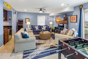 Unwind in the Game Room with a Flat Screen TV, Foosball Table, and Arcade Game System!