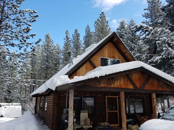Front door and porch from top of driveway