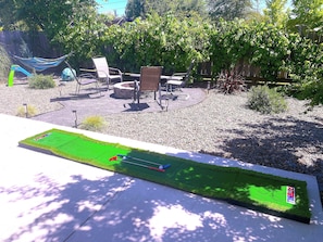 Enjoy your time outside with multiple seating areas, corn-hole, and a golf game!