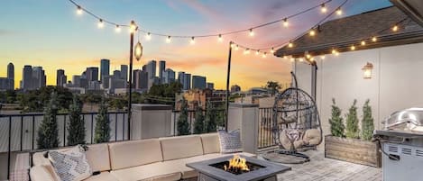 Large private 500 sq ft rooftop terrace with stunning views of downtown. Fully equipped with a grill, fire pit, outdoor couches, dining table and more!