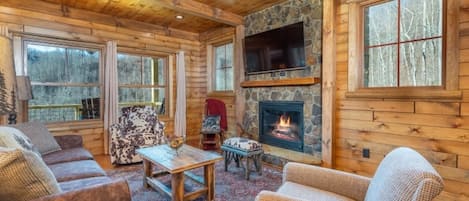 Cozy up around the gas logs fireplace in the living room to watch your favorite shows and movies on the satellite TV.