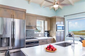 The kitchen is fully equipped with quality appliances
