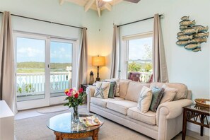 A cozy sitting spot with a calming view. This sofa opens to a queen-sized bed to sleep 2