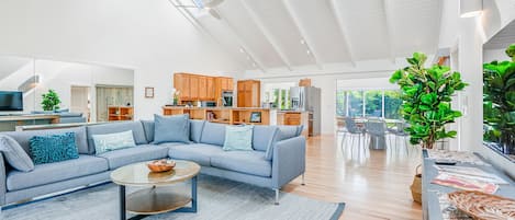 Large, open beam living area with garden views.