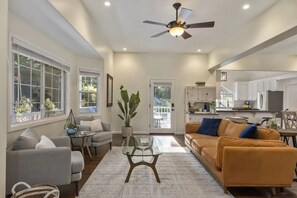 Sun-lit Great Room with tasteful sitting space for you to enjoy.
