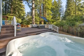 Soak in the brand new luxurious 7 person hot tub as your stresses melt away.
