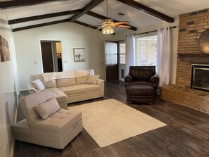 Large living room with a sleeper sofa.